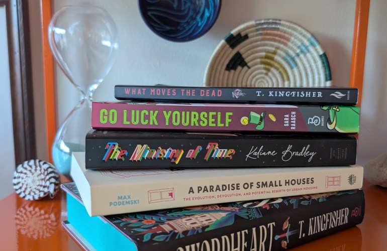 Stack of five books on a bookshelf.